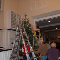 Josh Thompson helps the tree come to life.
