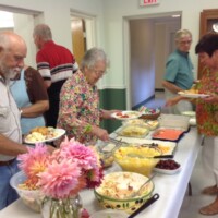 Charlie Asbury, Martha Massie and others load up with lots of great food.